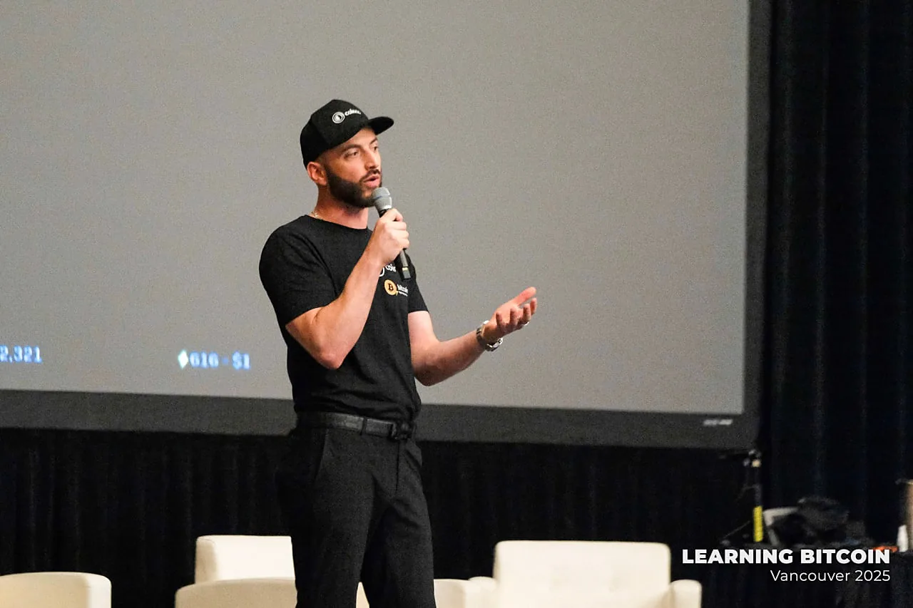 Cole Goodwin speaking on stage